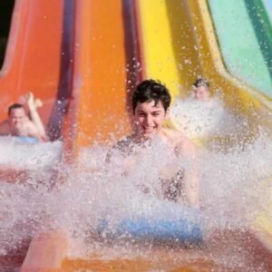 Seb Smith sliding down the water slide