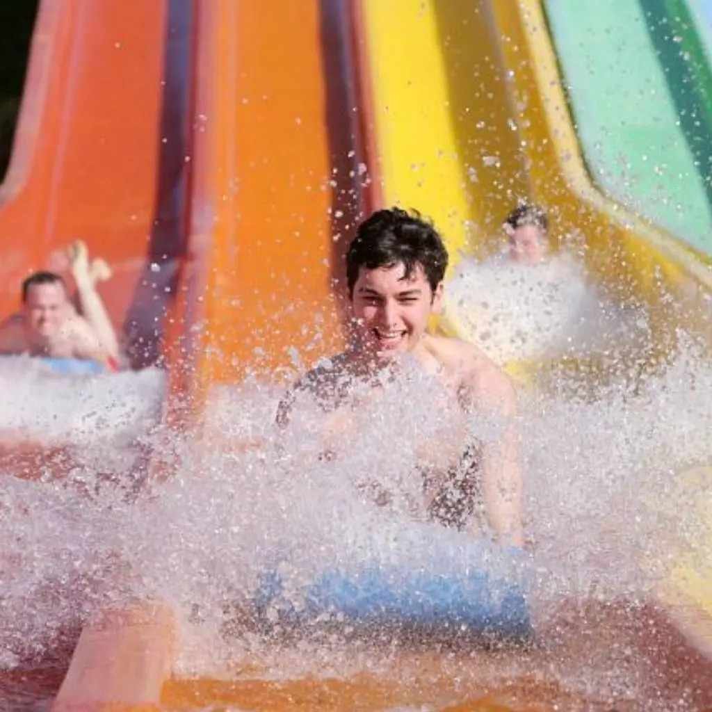 Seb Smith sliding down the water slide